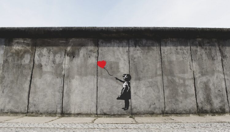 274231-banksy-on-the-berlin-wall