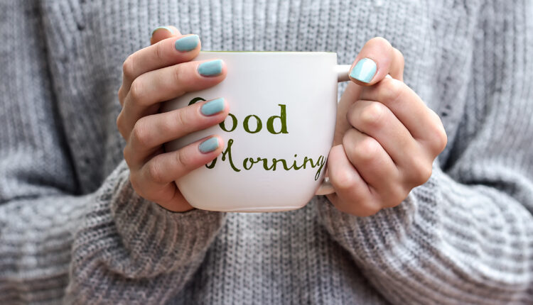 Girl holding a cup of coffee